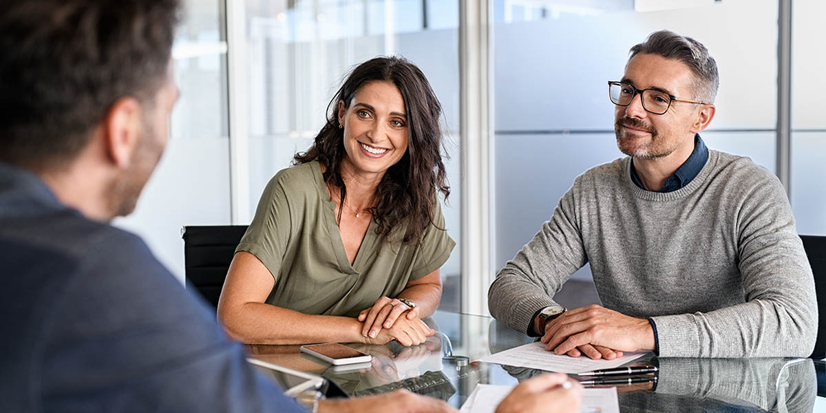 Couple speaks with advisor to learn more about pledged asset lines of credit